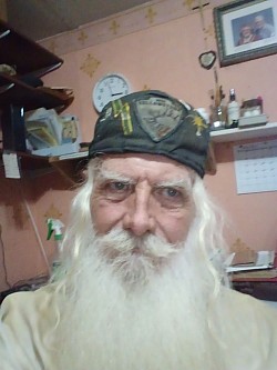 This is my photo at my new age of 73 on date of 07-25-2026 I am wearing my old hat as I need to make some new kepas and a new red hat for public wearing.